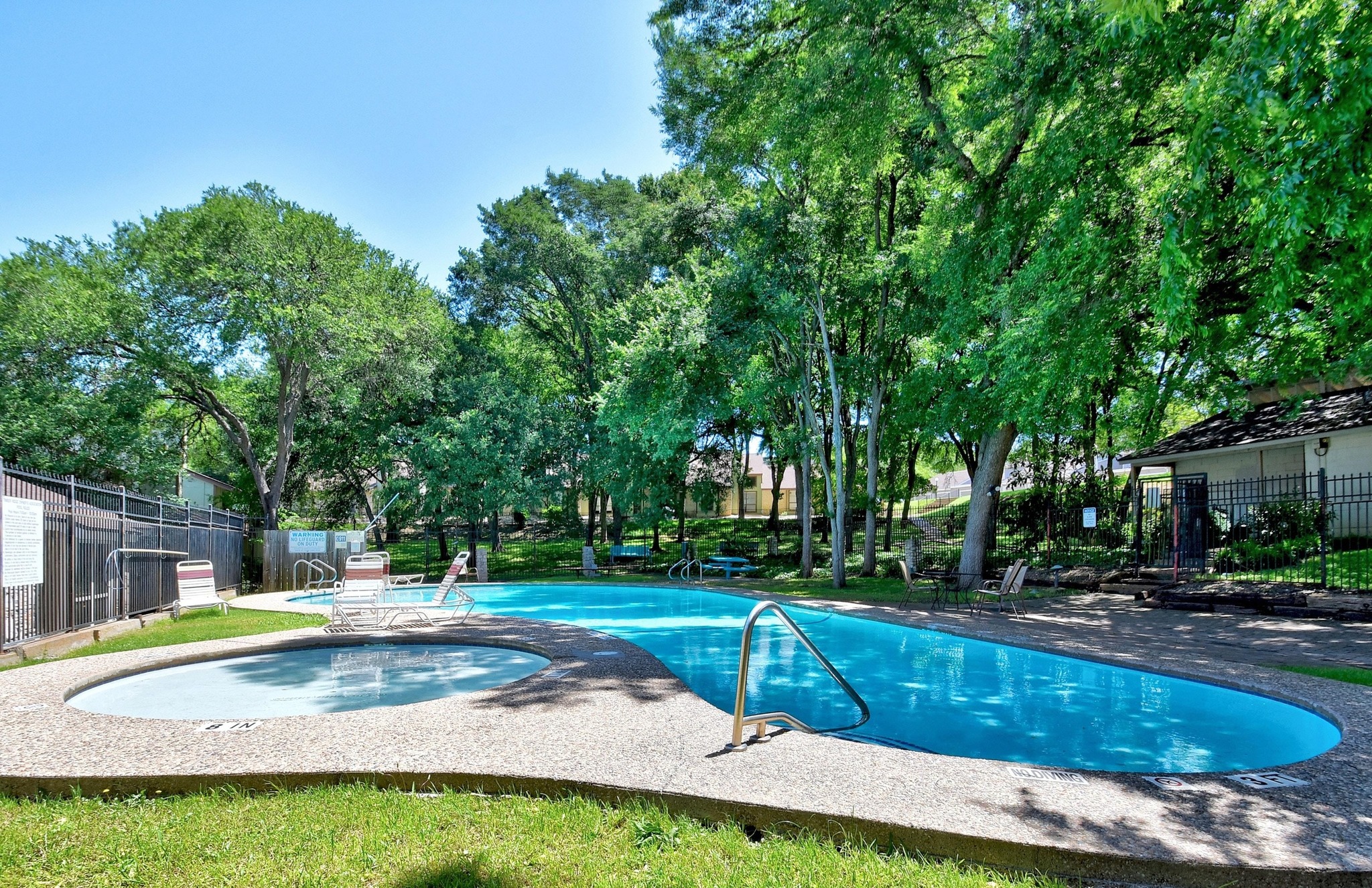 1750 Timber Ridge Road, Unit 102 Austin, TX 78741 - Photo 21 of 24 a view of a swimming pool with a patio