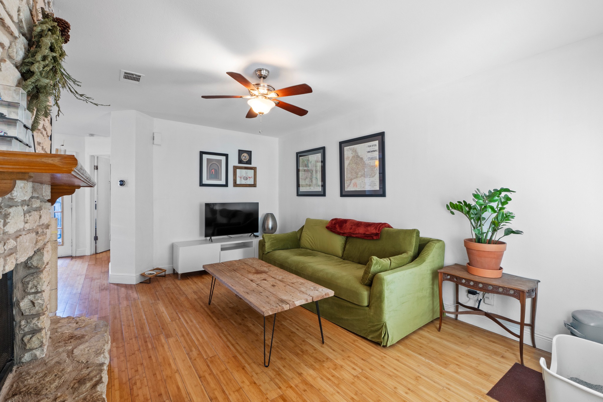 1750 Timber Ridge Road, Unit 102 Austin, TX 78741 - Photo 5 of 24 a living room with furniture and a fireplace