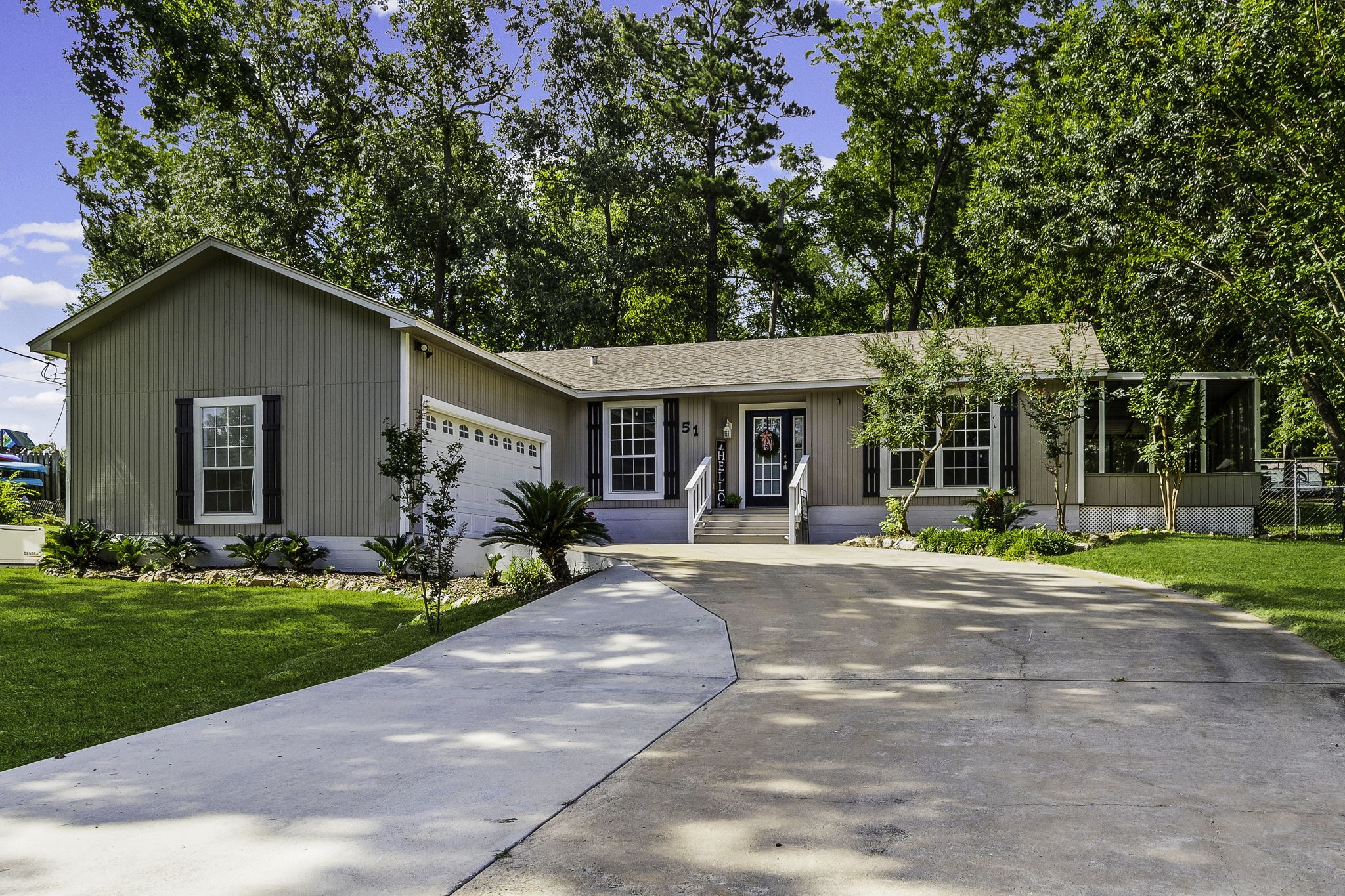 51 Rustling Oaks Coldspring, TX 77331 - Photo 3 of 43 Over-sized driveway allows for plenty of parking!