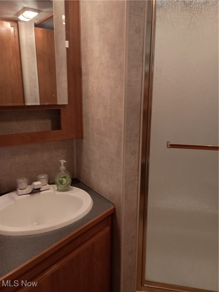 Opossum Run Road, Unit 184 Senecaville, OH 43780 - Photo 19 of 20 Bathroom with vanity and a stall shower