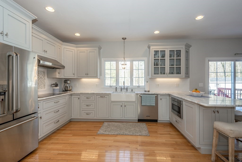 5 Nelson Court Mendon, MA 01756 - Photo 15 of 41 a kitchen with a sink stove cabinets and refrigerator