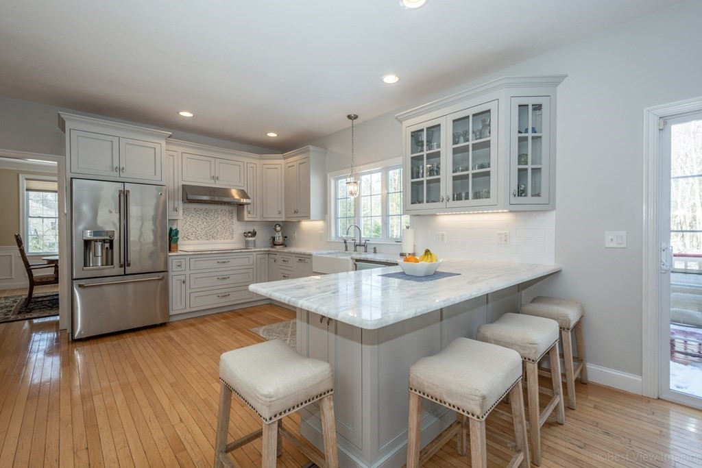 5 Nelson Court Mendon, MA 01756 - Photo 16 of 41 a kitchen with refrigerator and chairs