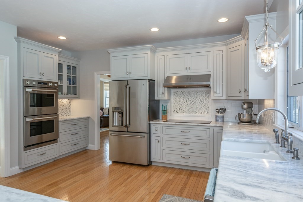 5 Nelson Court Mendon, MA 01756 - Photo 17 of 41 a kitchen with granite countertop a refrigerator and a stove top oven
