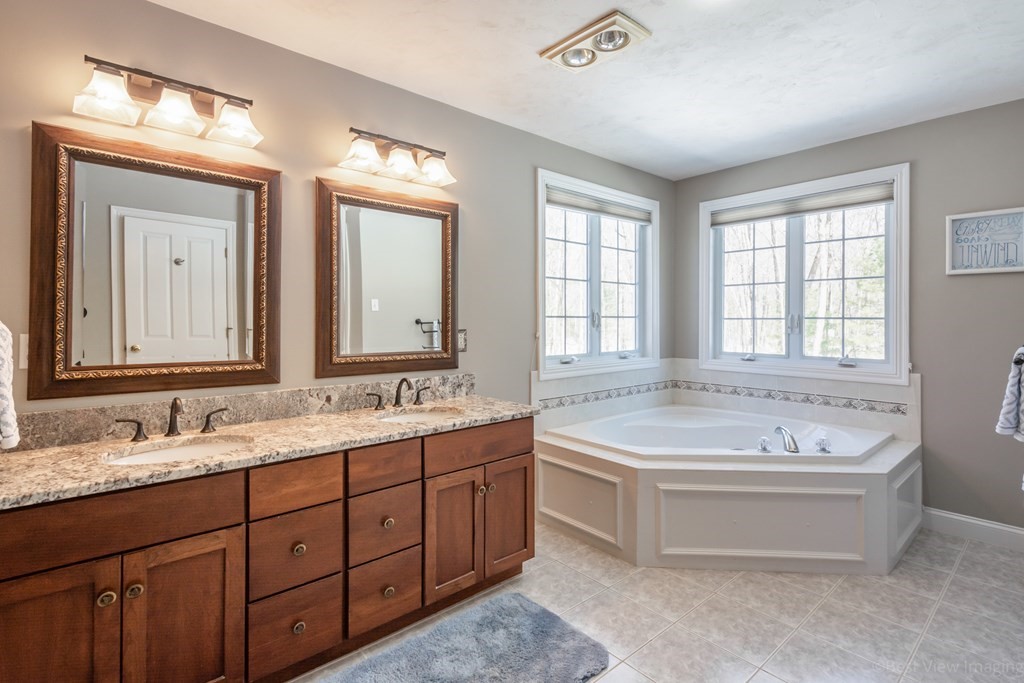 5 Nelson Court Mendon, MA 01756 - Photo 24 of 41 a spacious bathroom with a tub double sink and mirror