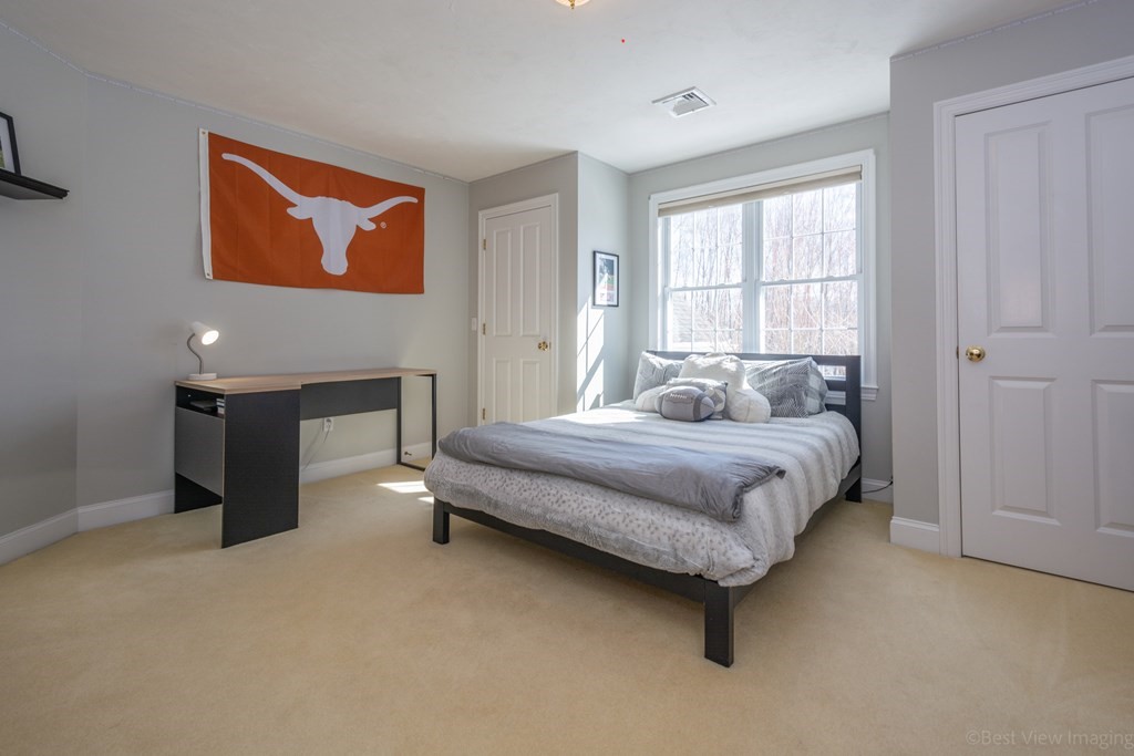 5 Nelson Court Mendon, MA 01756 - Photo 26 of 41 a bedroom with a bed and a painting
