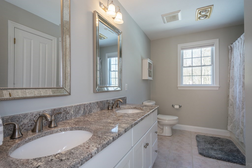 5 Nelson Court Mendon, MA 01756 - Photo 31 of 41 a bathroom with a granite countertop sink and a mirror