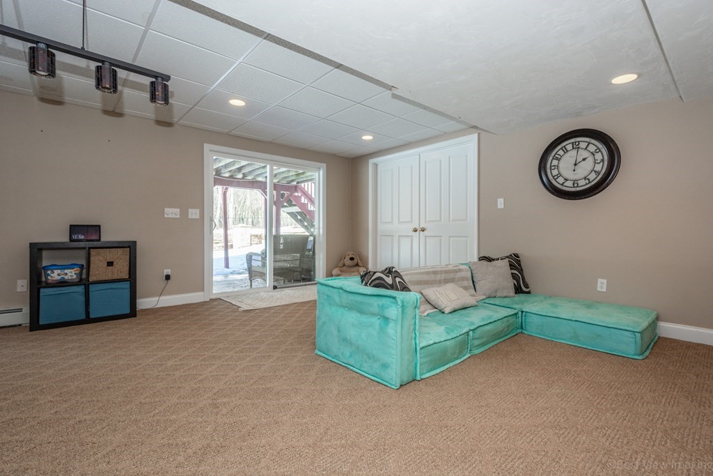 5 Nelson Court Mendon, MA 01756 - Photo 34 of 41 a living room with couch and a large window