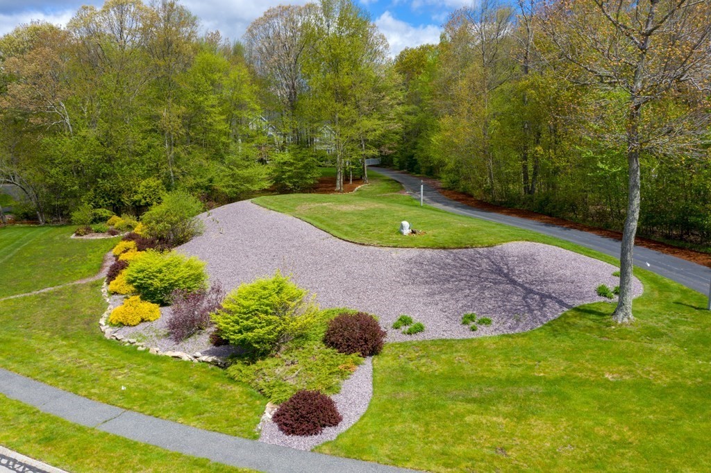 5 Nelson Court Mendon, MA 01756 - Photo 36 of 41 a view of a backyard with potted plants and large trees