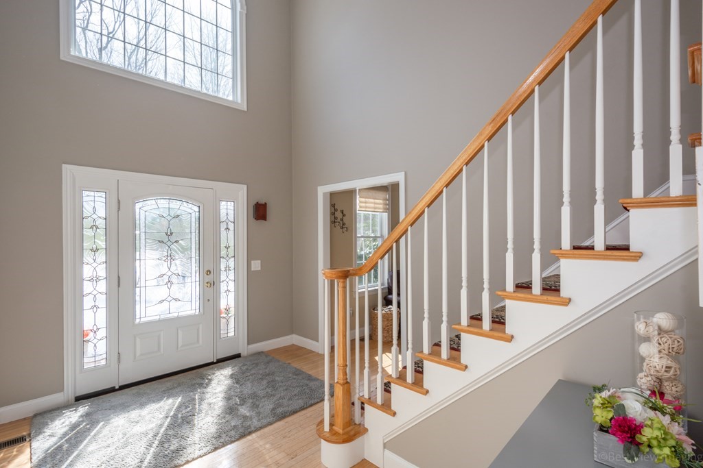 5 Nelson Court Mendon, MA 01756 - Photo 5 of 41 a view of an entryway with wooden floor and windows