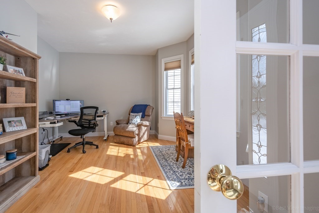 5 Nelson Court Mendon, MA 01756 - Photo 10 of 41 a living room with furniture and a book shelf
