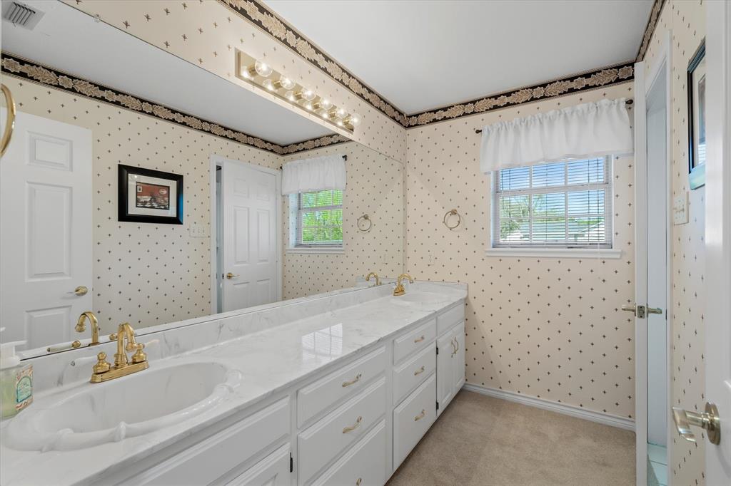 271 VZ County Road Canton, TX 75103 - Photo 29 of 40 a bathroom with a double vanity sink mirror and shower