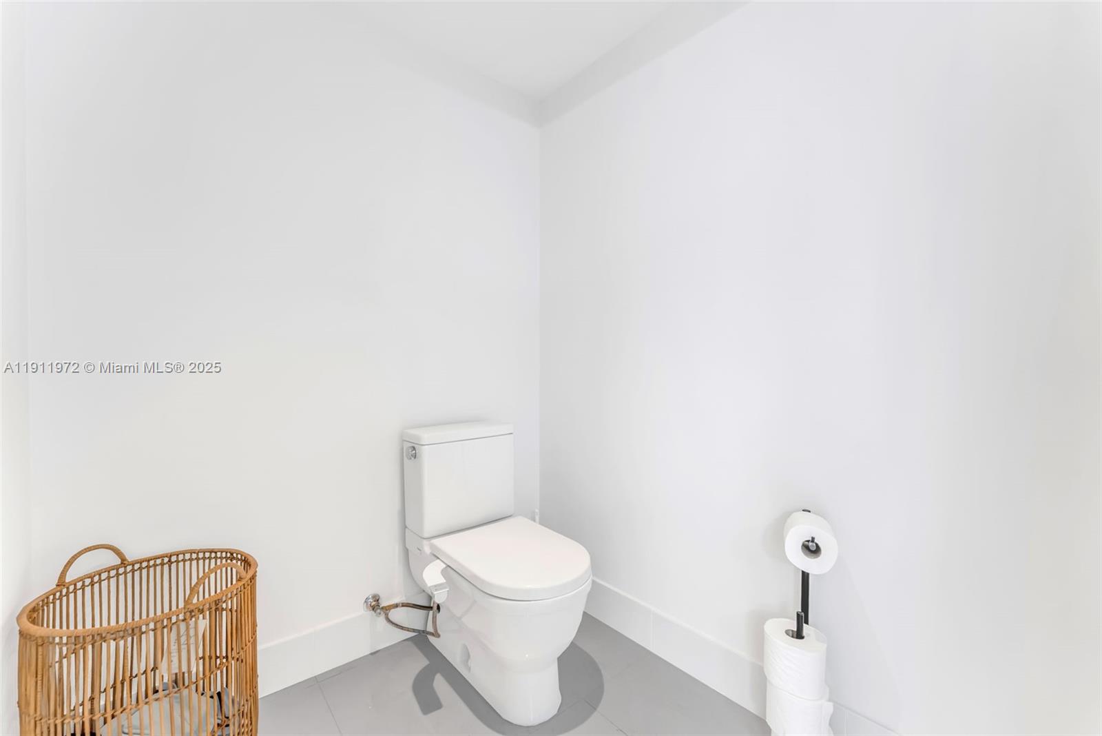 300 Sunny Isles Boulevard, Unit 4905 Sunny Isles Beach, FL 33160 - Photo 21 of 35 a white toilet sitting next to a shower