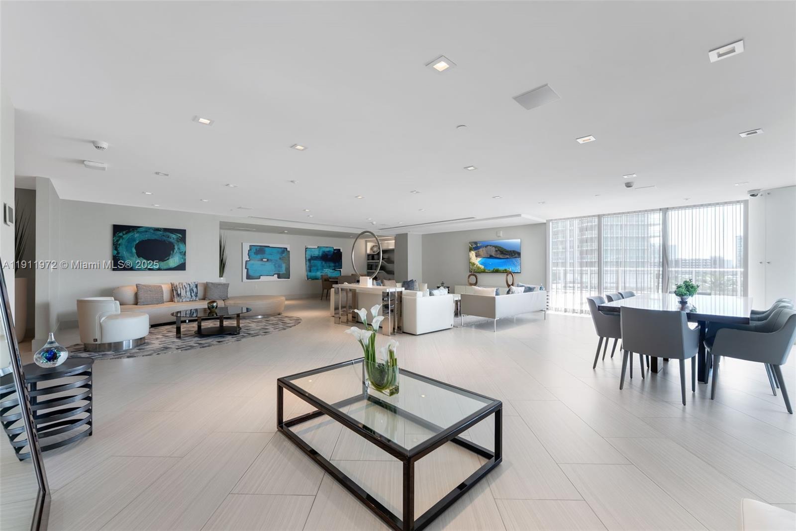 300 Sunny Isles Boulevard, Unit 4905 Sunny Isles Beach, FL 33160 - Photo 24 of 35 a living room with furniture and a table