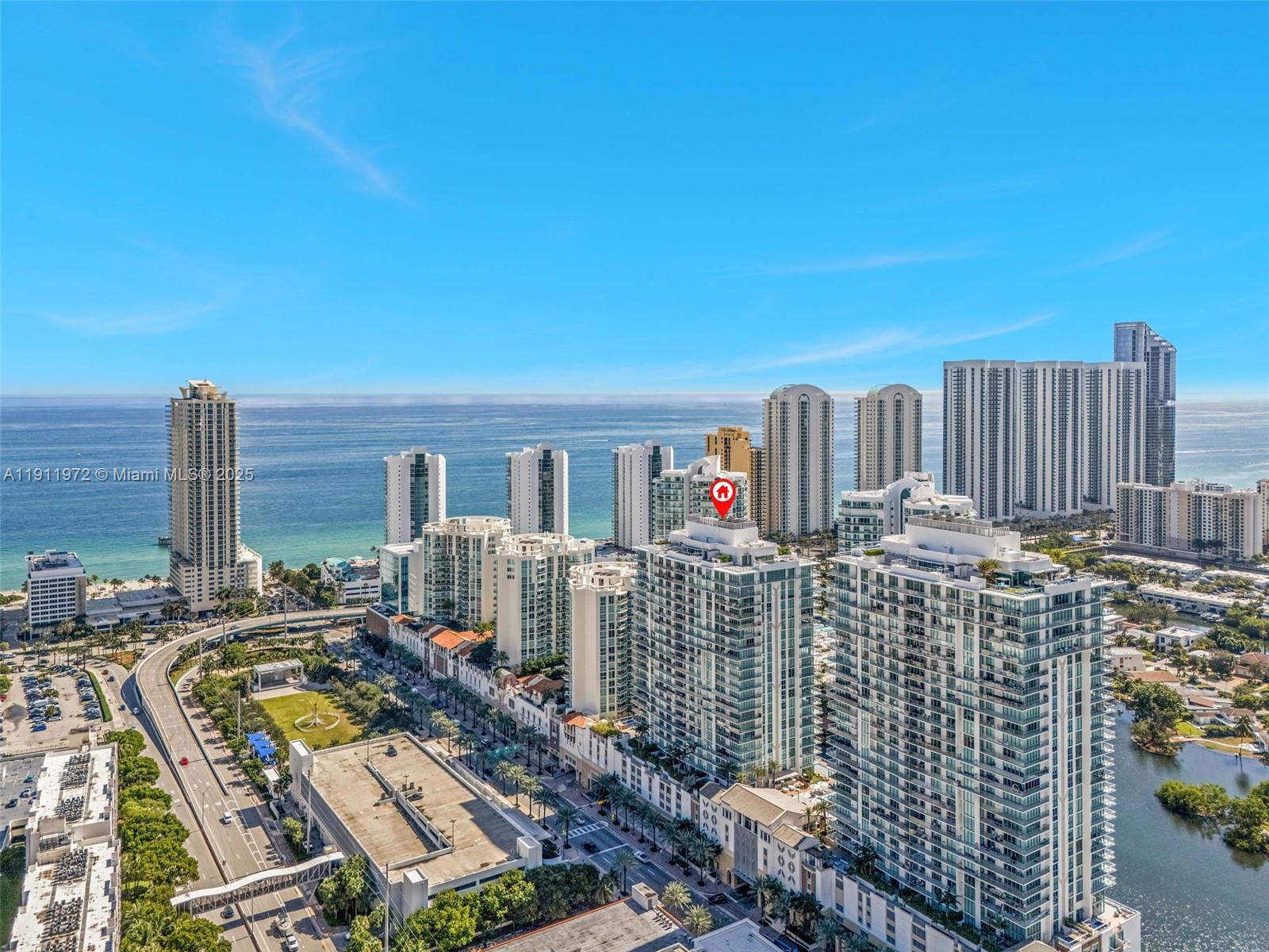 300 Sunny Isles Boulevard, Unit 4905 Sunny Isles Beach, FL 33160 - Photo 32 of 35 a view of roof with city view