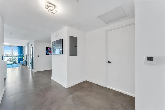 a view of a livingroom with an empty space and a stove