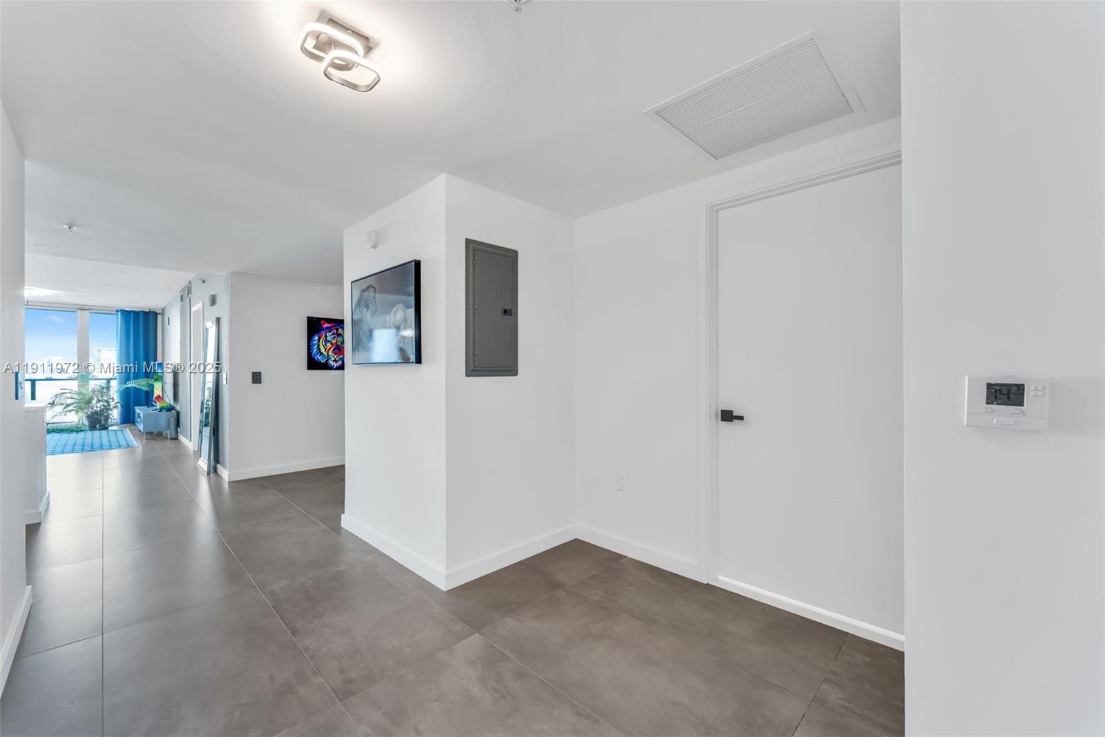 300 Sunny Isles Boulevard, Unit 4905 Sunny Isles Beach, FL 33160 - Photo 8 of 35 a view of a livingroom with an empty space and a stove