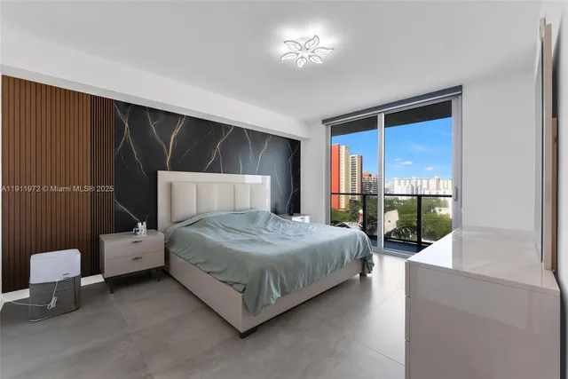 a bedroom with a bed and a mirror