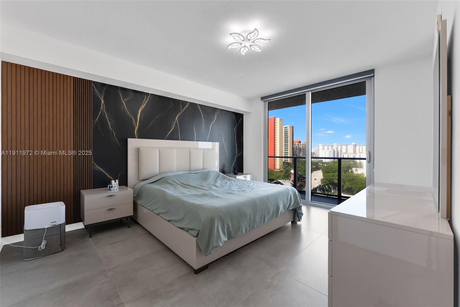 300 Sunny Isles Boulevard, Unit 4905 Sunny Isles Beach, FL 33160 - Photo 9 of 35 a bedroom with a bed and a mirror