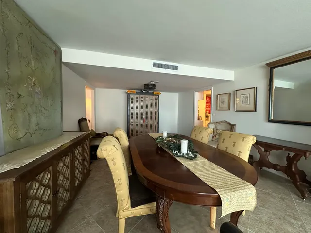 a spacious bedroom with a bed and a large window