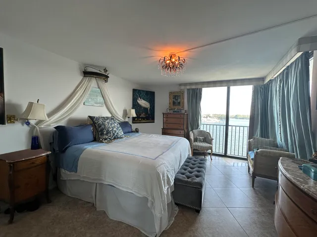 a bathroom with a sink a toilet a mirror and shower