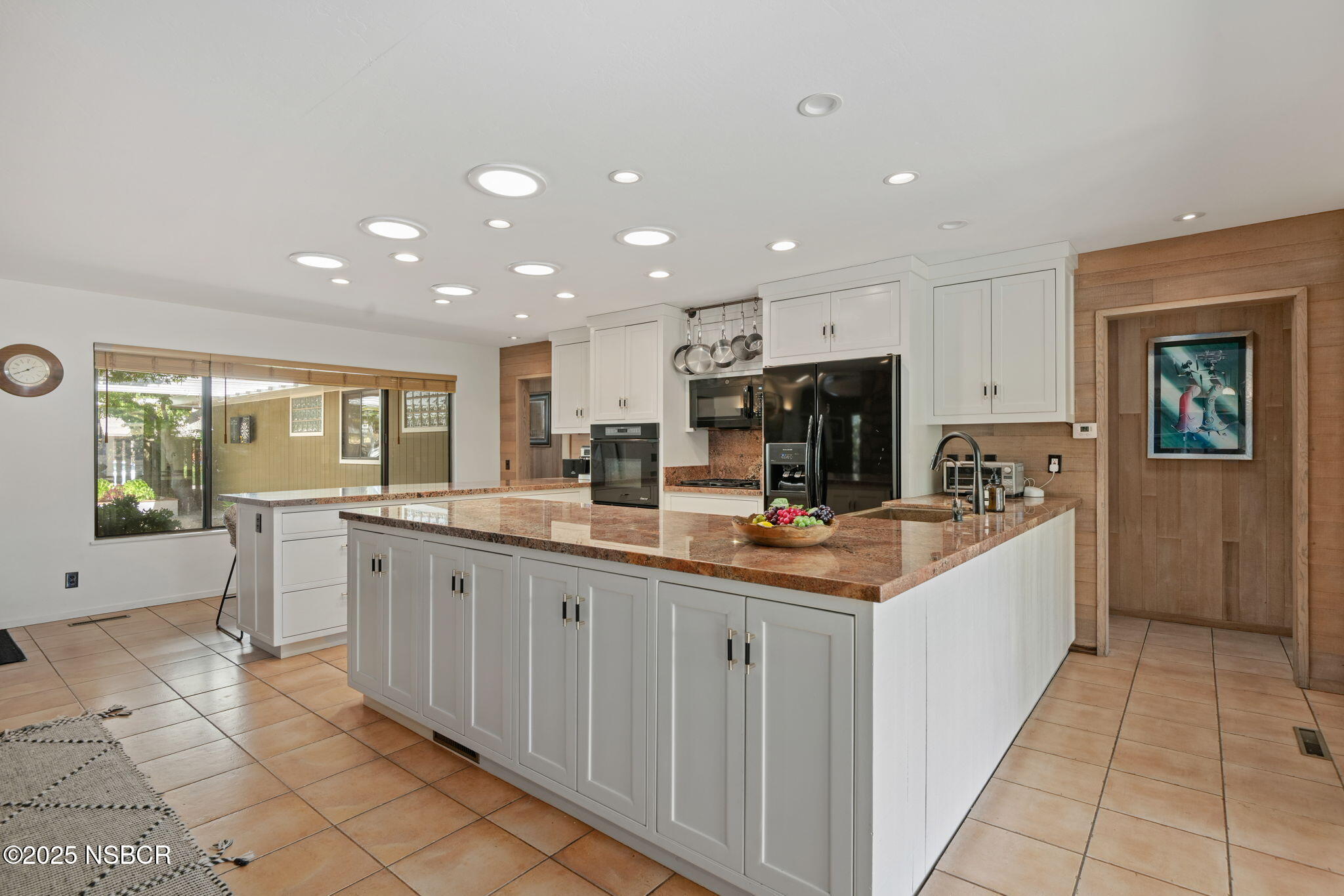 137 3rd Street Solvang, CA 93463 - Photo 18 of 48 a large kitchen with stainless steel appliances a sink and cabinets