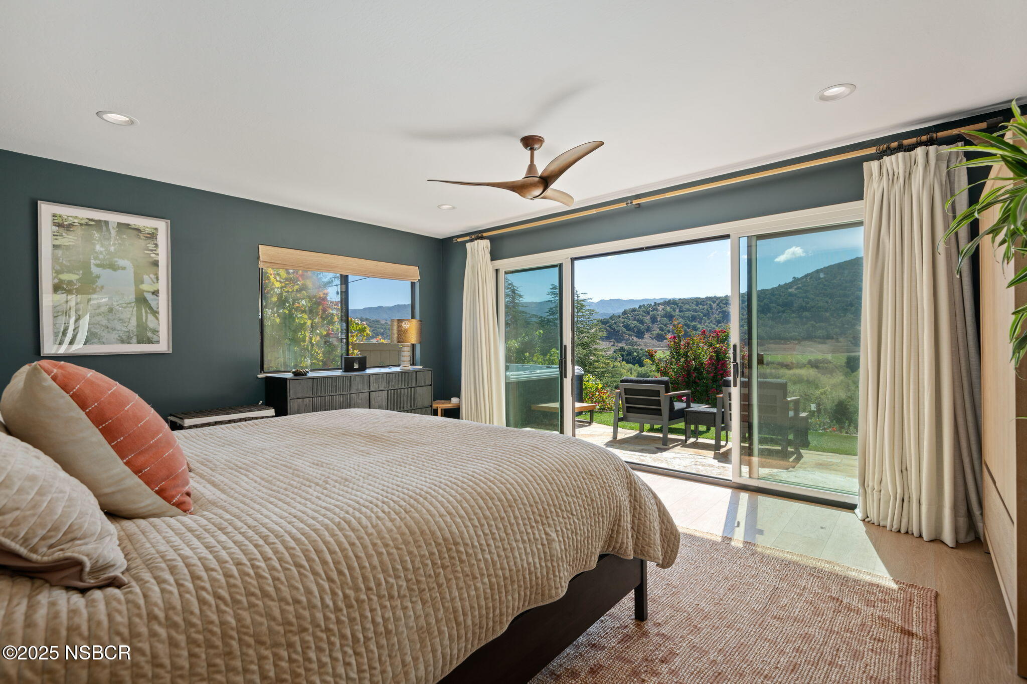 137 3rd Street Solvang, CA 93463 - Photo 19 of 48 a bedroom with a large bed and a balcony