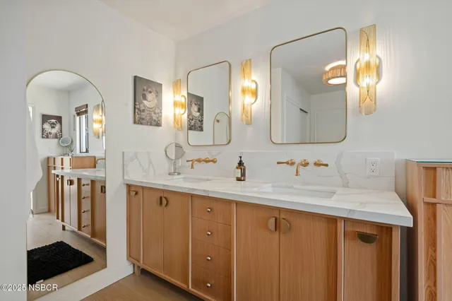 a bathroom with a sink a vanity and a mirror