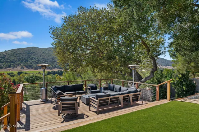 a view of a chairs and table in the patio