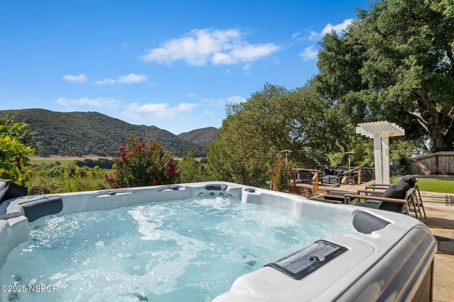 a view of a patio with couches table and a fire pit