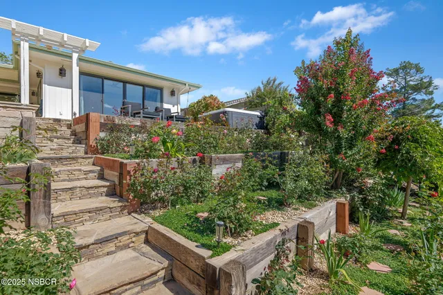a view of a garden in front of house