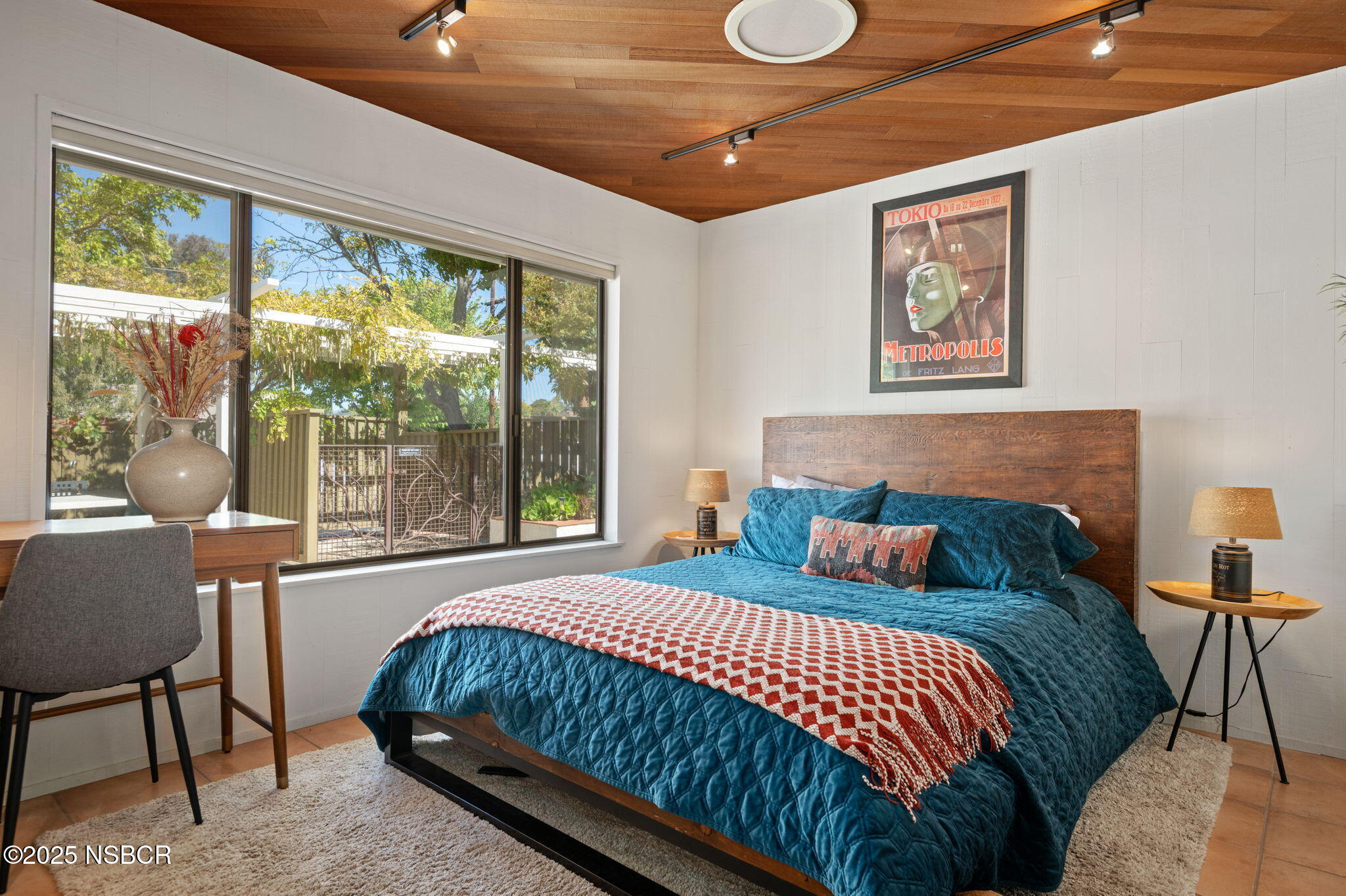 137 3rd Street Solvang, CA 93463 - Photo 39 of 48 a bedroom with a bed and a large window