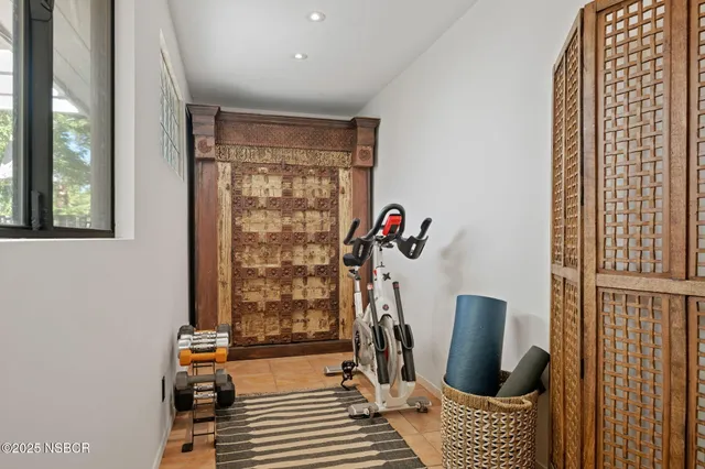 a view of a room with furniture and windows