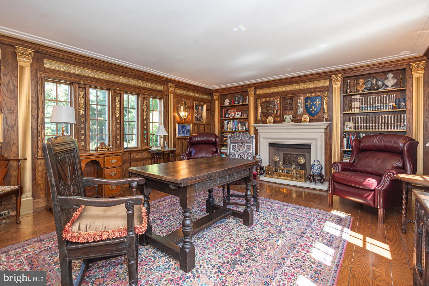 1224 Taylorsville Road Washington Crossing, PA 18977 - Photo 19 of 86 a living room with furniture a fireplace and a floor to ceiling window