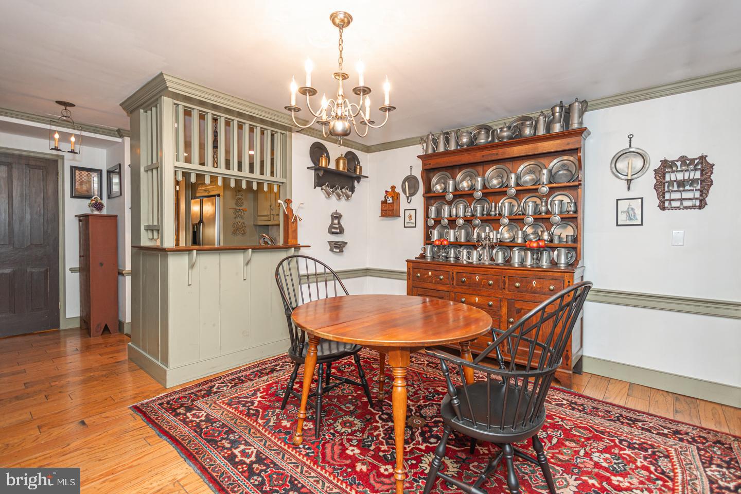 1224 Taylorsville Road Washington Crossing, PA 18977 - Photo 23 of 86 a dining room with furniture a chandelier and wooden floor