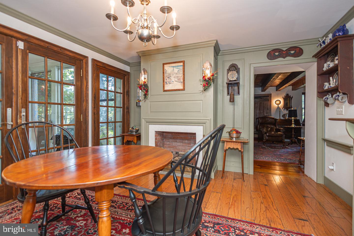 1224 Taylorsville Road Washington Crossing, PA 18977 - Photo 25 of 86 a dining room with furniture a chandelier and wooden floor