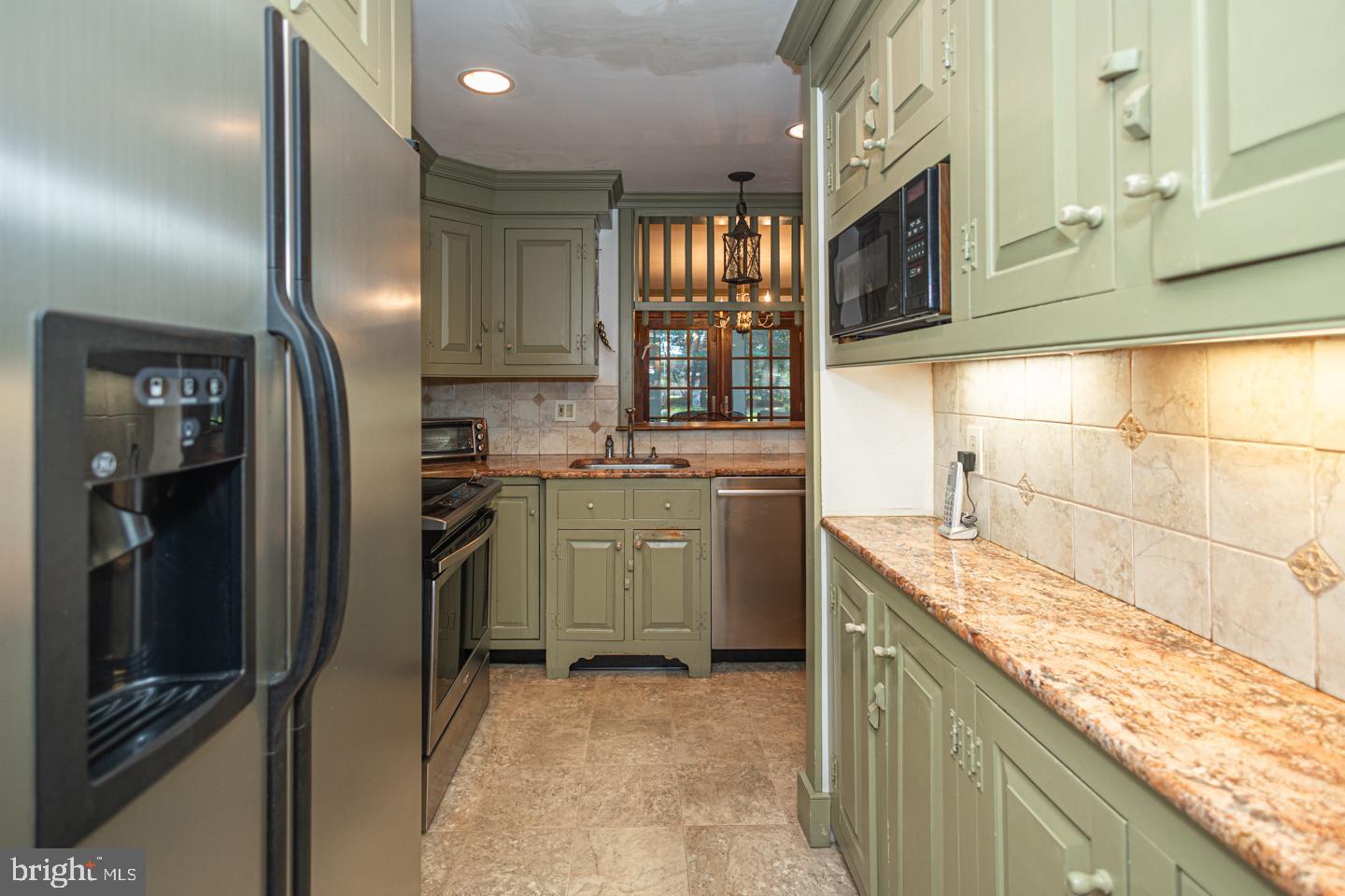 1224 Taylorsville Road Washington Crossing, PA 18977 - Photo 29 of 86 a kitchen that has a lot of cabinets in it