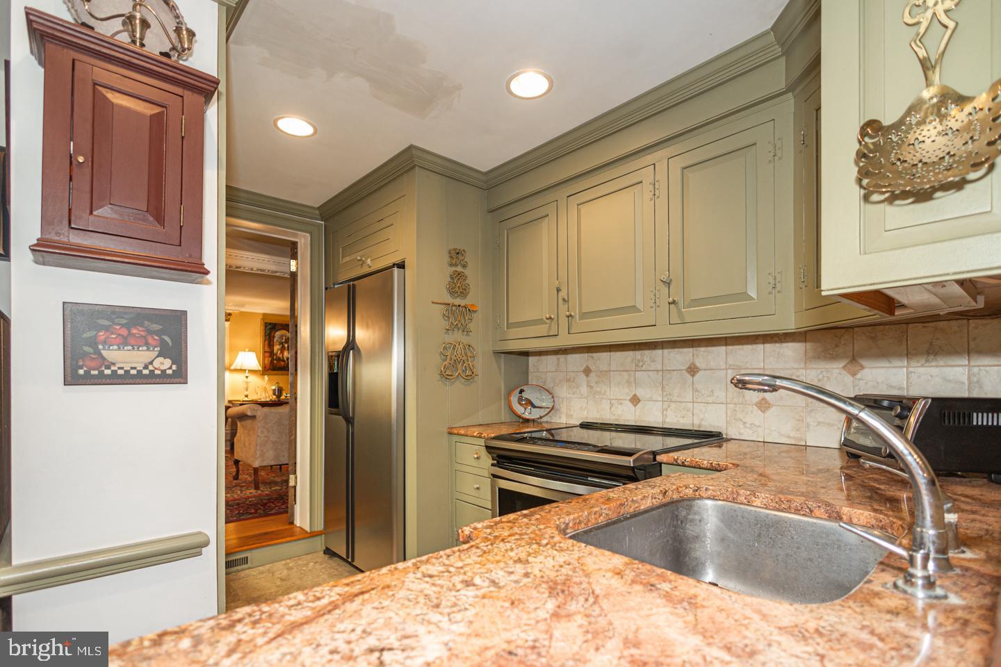 1224 Taylorsville Road Washington Crossing, PA 18977 - Photo 31 of 86 a kitchen with stainless steel appliances granite countertop a refrigerator and a sink