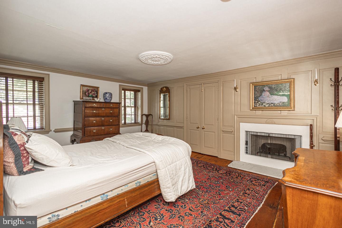 1224 Taylorsville Road Washington Crossing, PA 18977 - Photo 47 of 86 a spacious bedroom with a bed and a fireplace