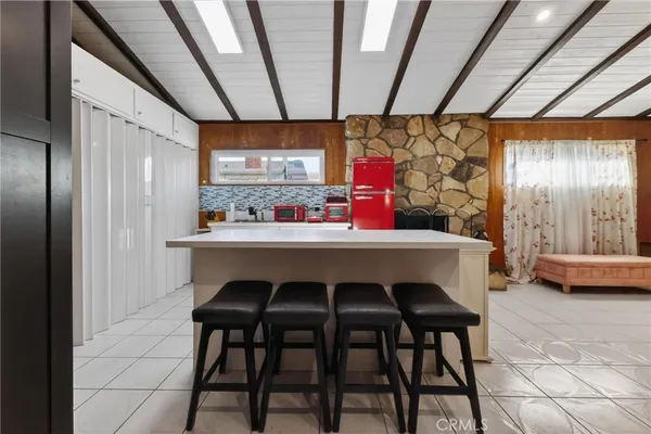 a kitchen with a table and chairs in it