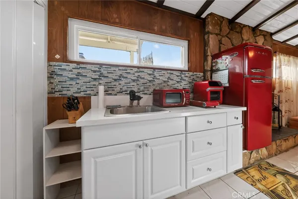 a kitchen with cabinets appliances and a counter top