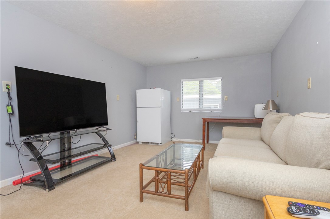 1116 Leatherdale Road Iva, SC 29655 - Photo 18 of 46 This versatile living area offers comfortable carpeting and natural light, perfect for everyday relaxation.