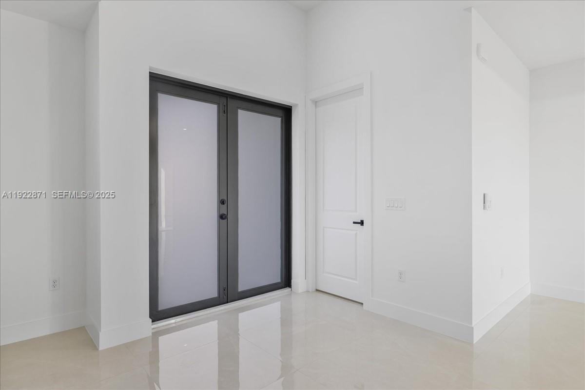 4207 28th Street Southwest Lehigh Acres, FL 33976 - Photo 12 of 39 a view of an empty room