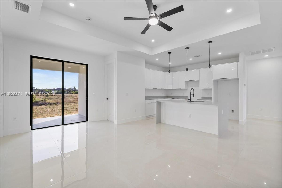 4207 28th Street Southwest Lehigh Acres, FL 33976 - Photo 17 of 39 a view of kitchen with stainless steel appliances refrigerator oven and cabinets