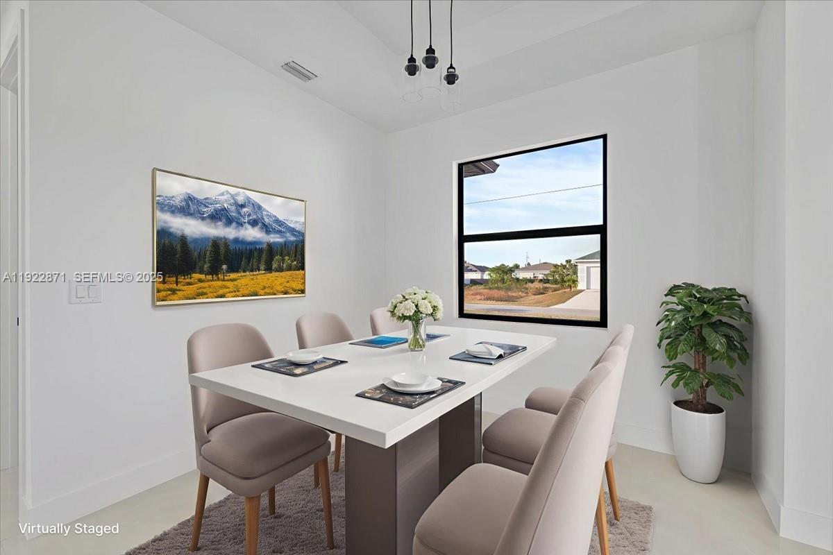 4207 28th Street Southwest Lehigh Acres, FL 33976 - Photo 3 of 39 a view of a dining room with furniture and window