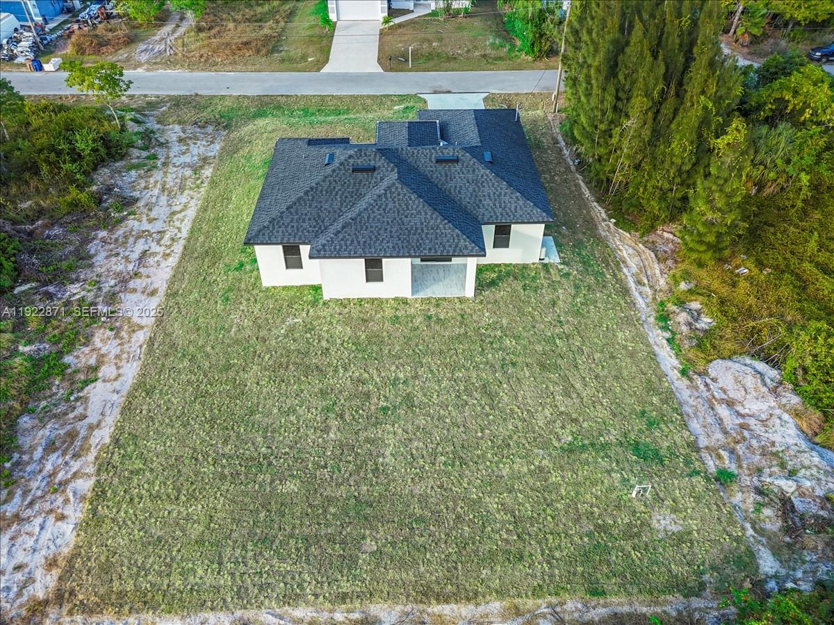 4207 28th Street Southwest Lehigh Acres, FL 33976 - Photo 34 of 39 an aerial view of a house