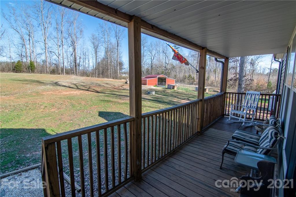 740 Renshaw Ford Road, Unit 5 Woodleaf, NC 27054 - Photo 11 of 30 a view of a porch with wooden floor