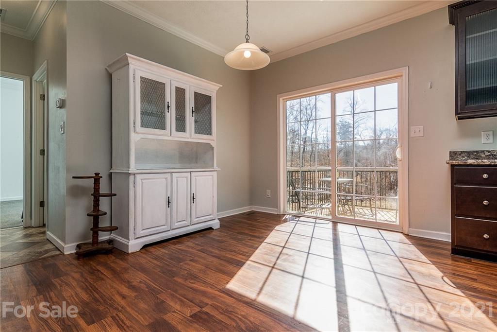 740 Renshaw Ford Road, Unit 5 Woodleaf, NC 27054 - Photo 16 of 30 a view of a room with wooden floor and windows