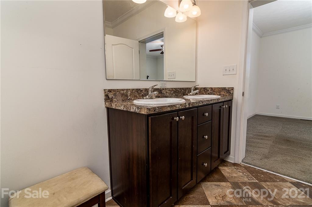 740 Renshaw Ford Road, Unit 5 Woodleaf, NC 27054 - Photo 19 of 30 a bathroom with a sink and a mirror