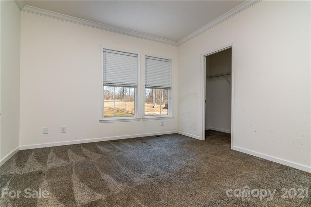 740 Renshaw Ford Road, Unit 5 Woodleaf, NC 27054 - Photo 21 of 30 an empty room with a empty space and windows