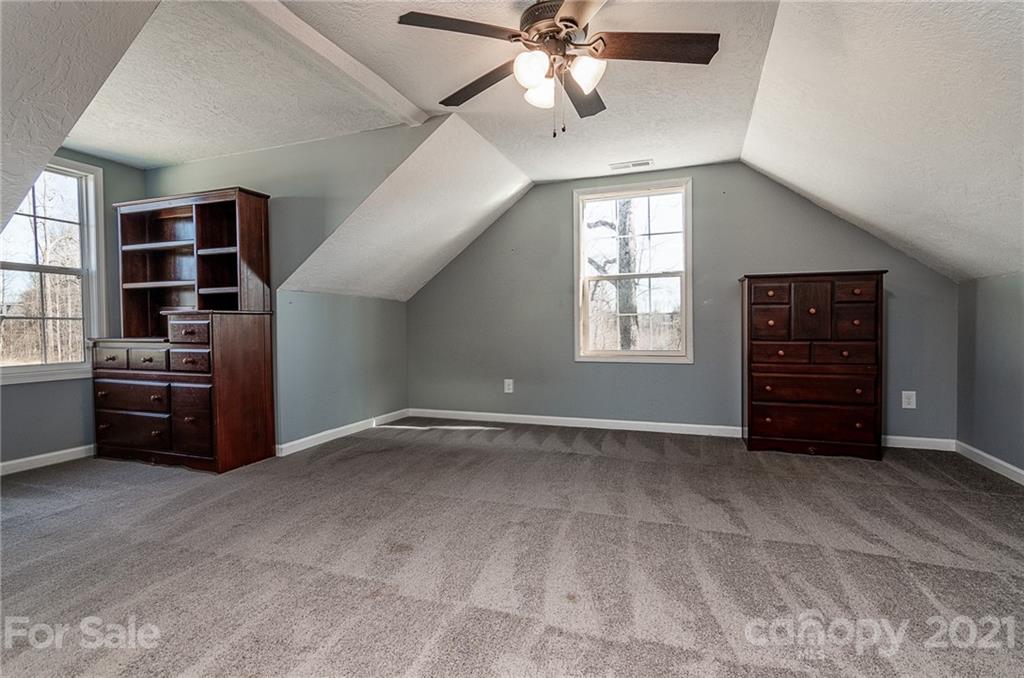 740 Renshaw Ford Road, Unit 5 Woodleaf, NC 27054 - Photo 24 of 30 a view of an empty room with a window and cabinet